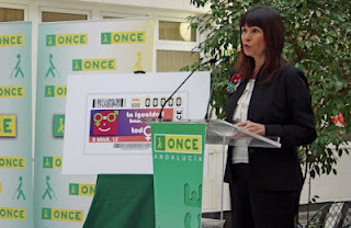 La consejera para la Igualdad y Bienestar Social de la Junta de Andalucía, Micaela Navarro durante su intervención en la presentación del cupón dedicado al Día Internacional de la Mujer