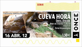 Imagen del cupón del 16 de abril dedicado al Bien de Interés Cultural la Cueva Horá del Darro (Granada)