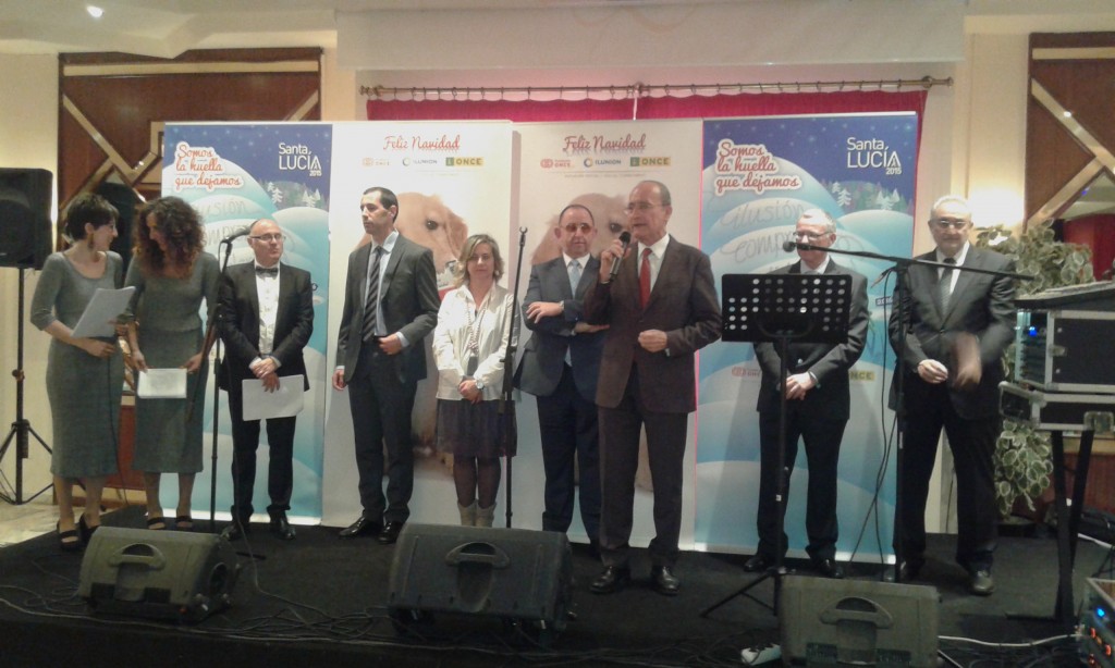 Primer plano de los asistentes al acto central de Santa Lucía de la ONCE de Málaga 