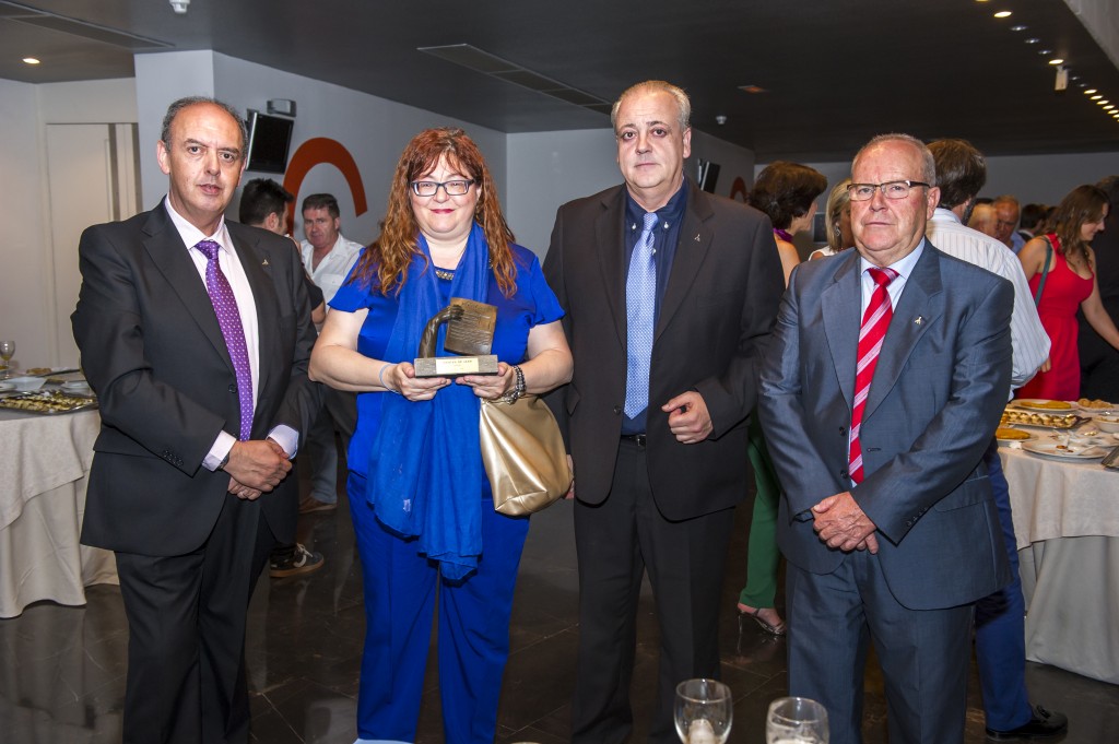 Foto de familia de los representantes de la ONCE tras el acto